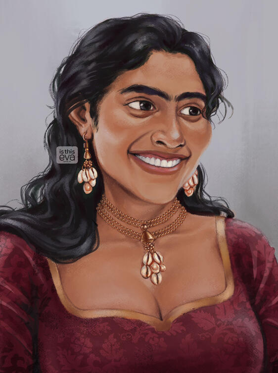 Portrait of a person with light brown skin and black hair, smiling as she gazes off to a side. She's wearing cowrie jewellery and a red patterned blouse.